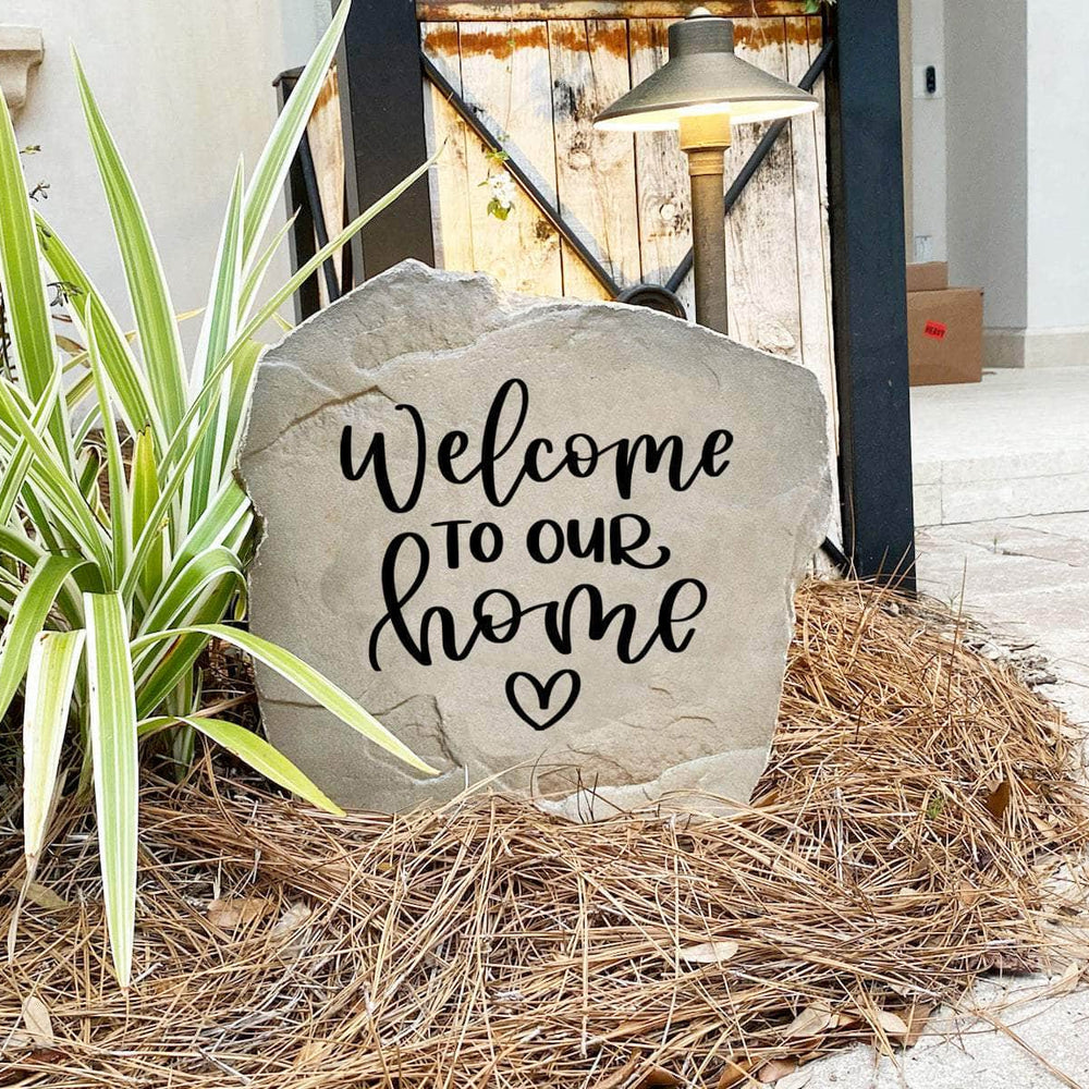 Elegant outdoor welcome plaque displaying "Welcome To Our Home" with a heart motif, perfect for enhancing curb appeal and greeting guests.