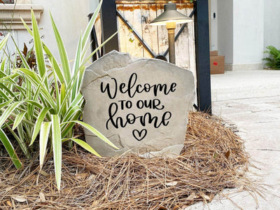 Decorative welcome heart rock for garden or front porch.