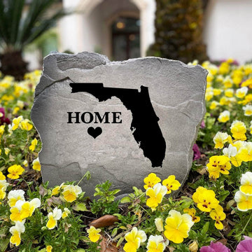 Weather-resistant personalized state lawn stone crafted to add character and regional pride to flower beds, entryways, and backyard living spaces.